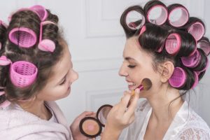 daughter-putting-powder-mothers-cheek_23-2148070341 daughter-putting-powder-mothers-cheek_23-2148070341