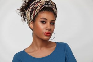 portrait-pensive-young-attractive-curly-brunette-woman-with-nose-piercing-looking-attentively-camera-keeping-lips-folded-standing-white-background portrait-pensive-young-attractive-curly-brunette-woman-with-nose-piercing-looking-attentively-camera-keeping-lips-folded-standing-white-background